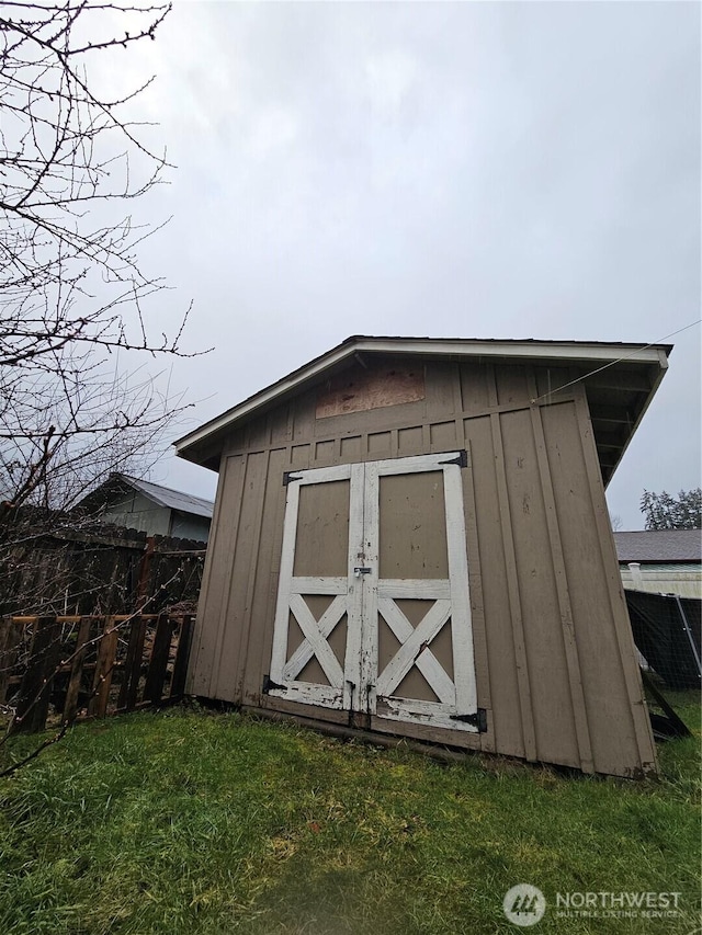 view of shed with fence