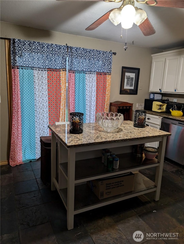 kitchen with a center island, white cabinetry, stainless steel dishwasher, and open shelves