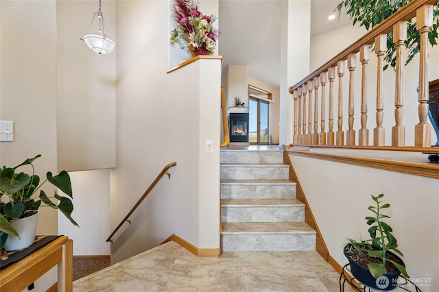 stairs featuring baseboards