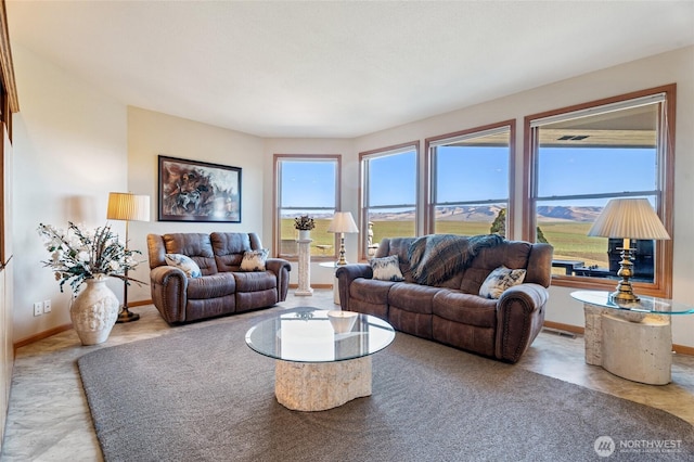 living room with visible vents and baseboards