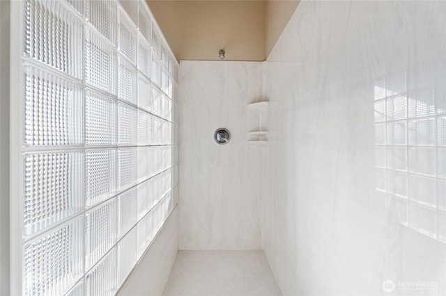 interior space featuring a tile shower