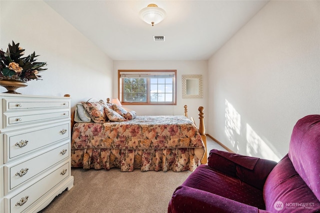 bedroom featuring carpet flooring and visible vents