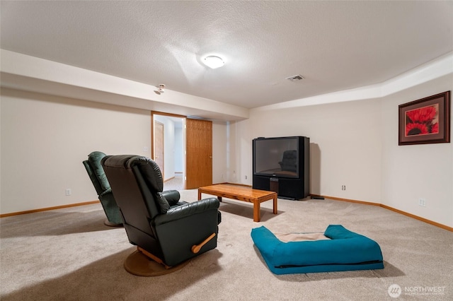 carpeted living area featuring visible vents, a textured ceiling, and baseboards