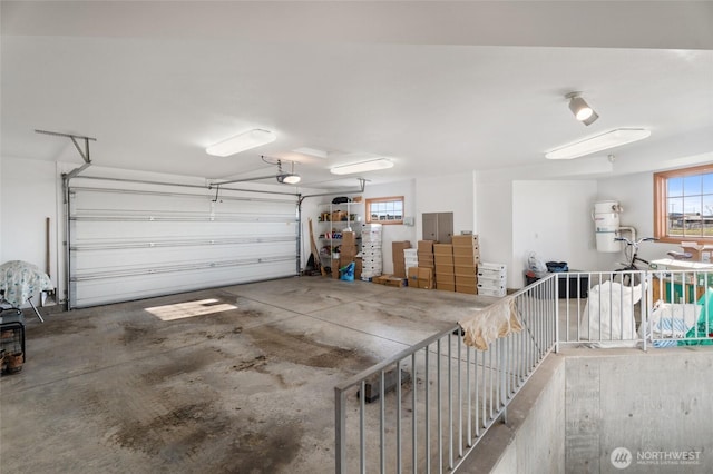 garage with electric panel and a garage door opener