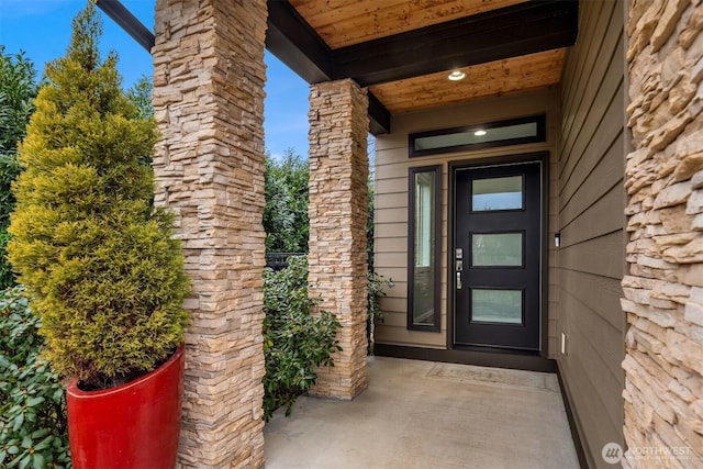 entrance to property with stone siding