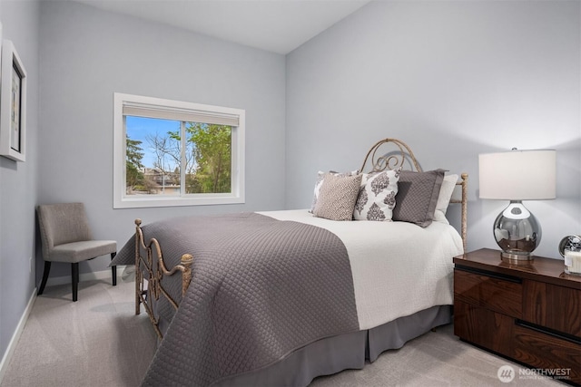 bedroom featuring carpet floors and baseboards