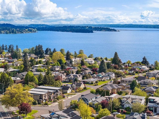 bird's eye view featuring a residential view and a water view