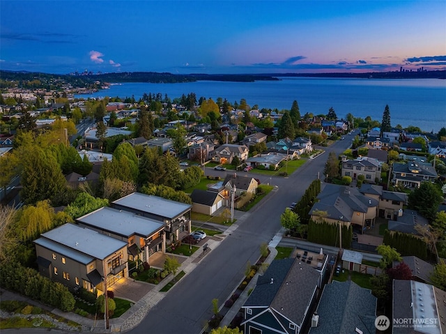 aerial view featuring a residential view and a water view