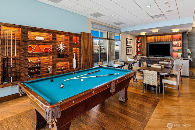 2821 2nd Ave Unit 1005, Seattle, WA 98121 - playroom with pool table, a paneled ceiling, built in features, and wood finished floors