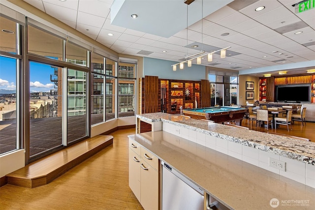2821 2nd Ave Unit 1005, Seattle, WA 98121 - recreation room featuring light wood-style flooring, a paneled ceiling, pool table, and baseboards
