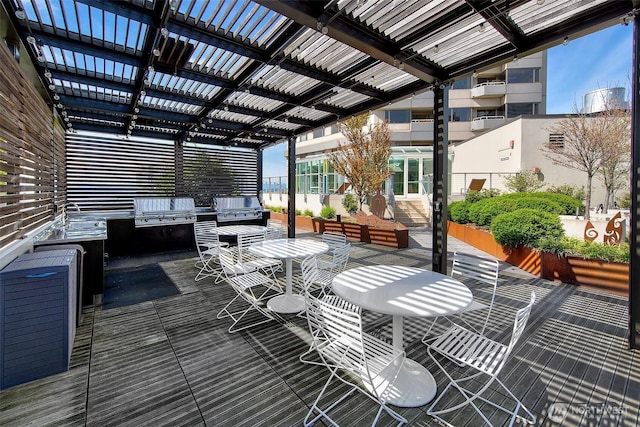 2821 2nd Ave Unit 1005, Seattle, WA 98121 - wooden deck featuring grilling area, outdoor dining space, area for grilling, and a pergola