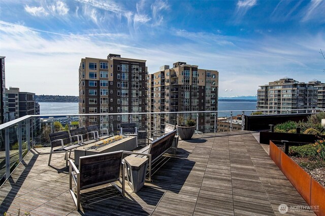 2821 2nd Ave Unit 1005, Seattle, WA 98121 - wooden deck featuring a water view