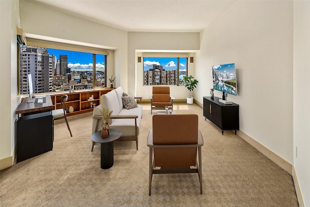 2821 2nd Ave Unit 1005, Seattle, WA 98121 - living area featuring a wealth of natural light, a view of city, baseboards, and carpet floors