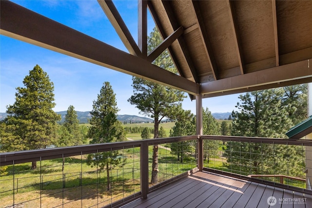 wooden deck featuring a mountain view