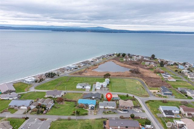 birds eye view of property with a residential view and a water view