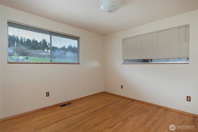 spare room with visible vents and light wood-style floors