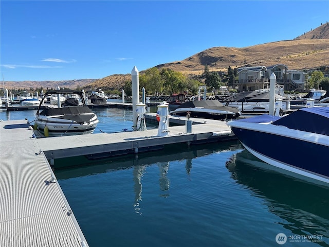 dock area featuring a water and mountain view