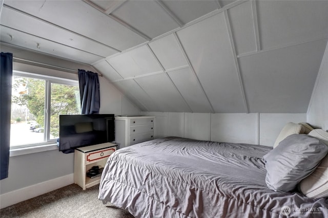 bedroom featuring carpet flooring, baseboards, and vaulted ceiling