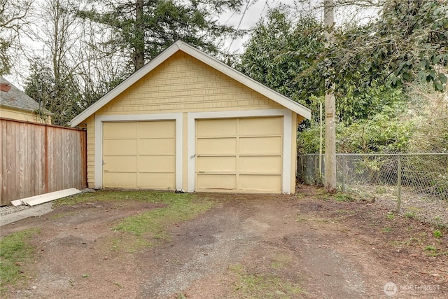 detached garage with fence