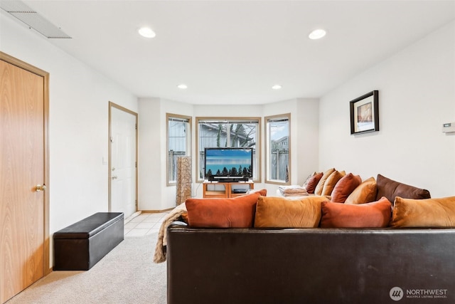 living room with light colored carpet, recessed lighting, and visible vents