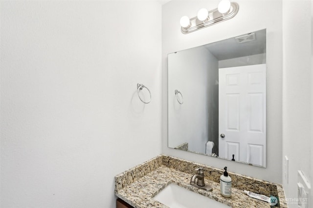 bathroom with visible vents and vanity