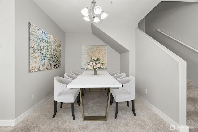 dining space with an inviting chandelier, carpet flooring, and baseboards