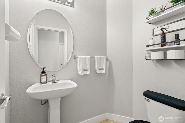 bathroom featuring toilet
