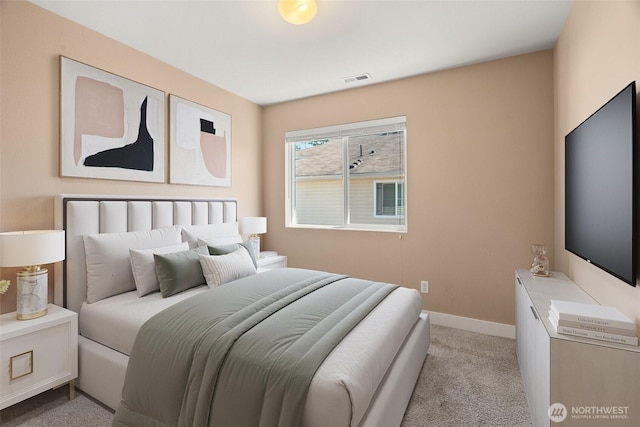 bedroom with light carpet, baseboards, and visible vents