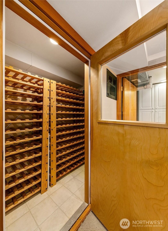 wine area featuring tile patterned floors