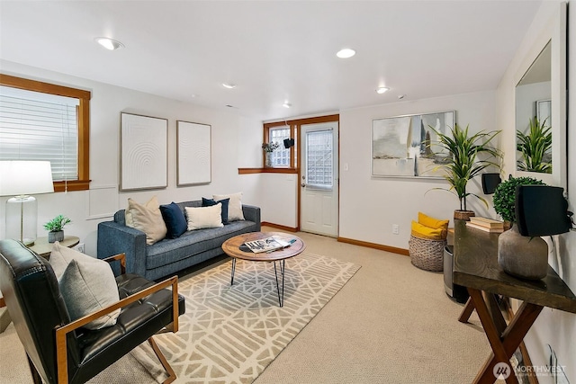 living area featuring light carpet, baseboards, and recessed lighting