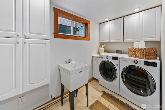 laundry area featuring light tile patterned floors, recessed lighting, cabinet space, separate washer and dryer, and baseboards