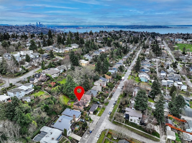 bird's eye view featuring a water view and a residential view