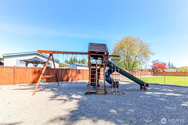 view of playground featuring fence