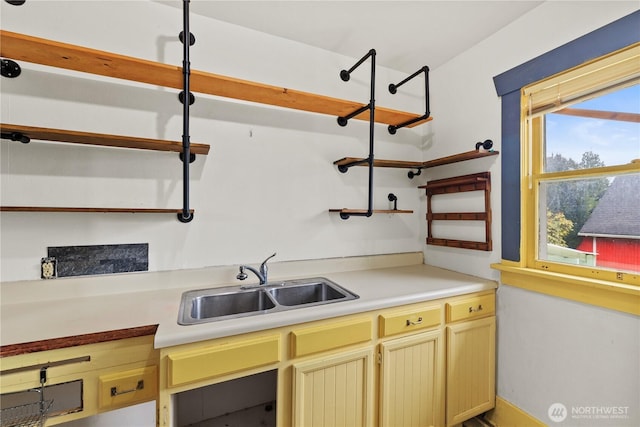 kitchen with light countertops and a sink