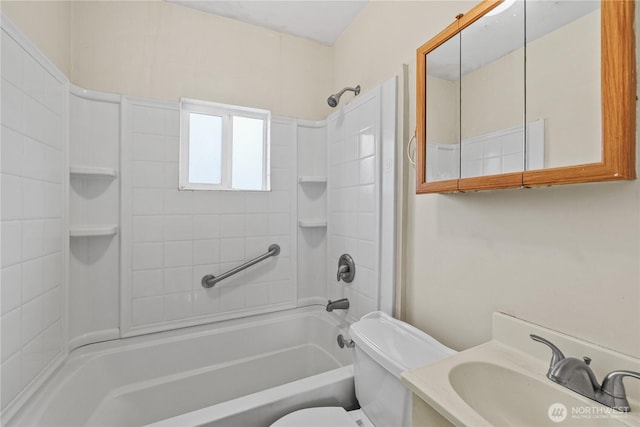 bathroom featuring vanity, toilet, and shower / bathtub combination