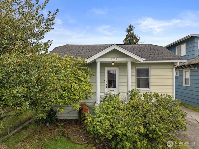 view of front of home featuring a shingled roof