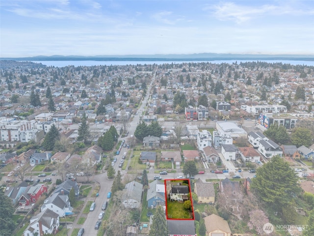 bird's eye view featuring a residential view and a water view