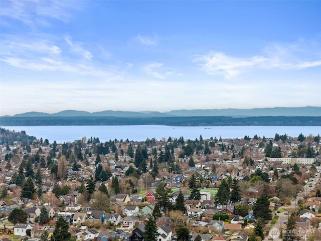 bird's eye view featuring a water and mountain view