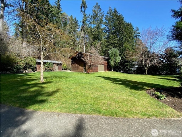 view of yard featuring an attached garage