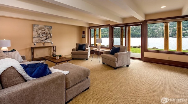 living room featuring baseboards, light colored carpet, beamed ceiling, a water view, and recessed lighting