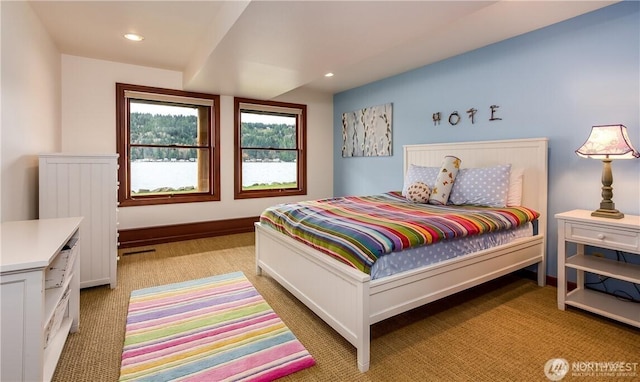 bedroom with baseboards, light carpet, and recessed lighting