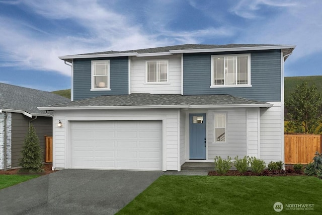 traditional-style house with aphalt driveway, a shingled roof, an attached garage, fence, and a front lawn