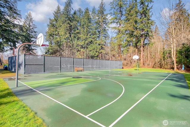 view of basketball court featuring community basketball court and fence