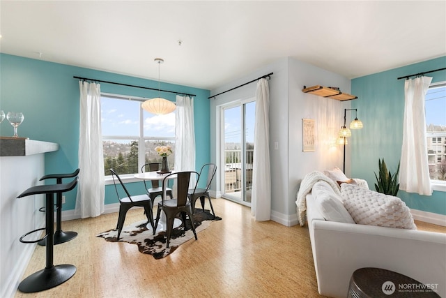 dining area featuring baseboards