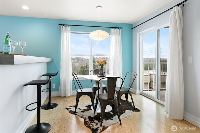 dining area with recessed lighting and baseboards