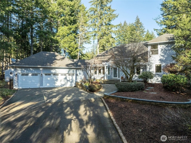 view of front of property featuring driveway and an attached garage