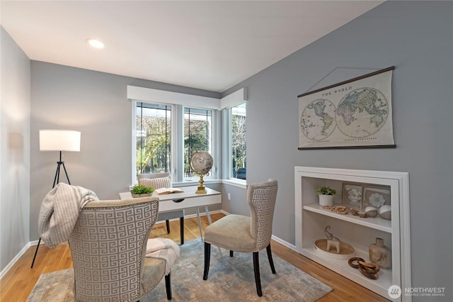 office space featuring light wood-style flooring and baseboards