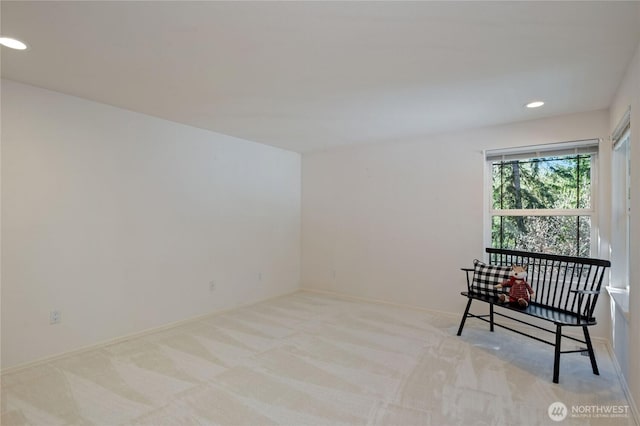 living area featuring carpet floors, baseboards, and recessed lighting