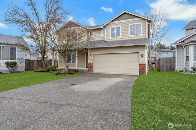 view of front of home with aphalt driveway, a front yard, fence, and a garage