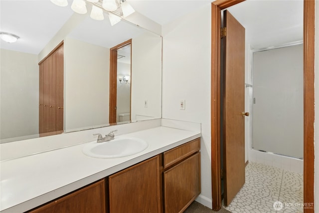 full bath featuring a stall shower and vanity